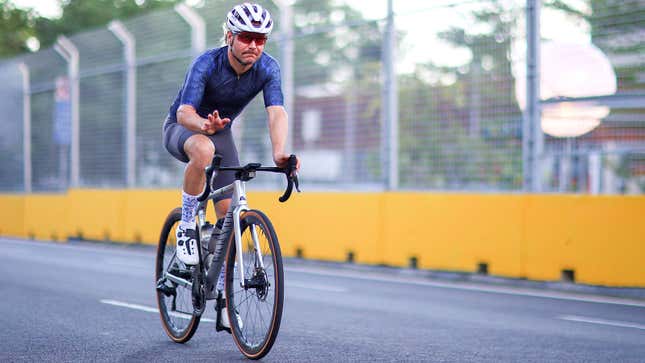 A photo of Valtteri Bottas riding a bike on a race track. 