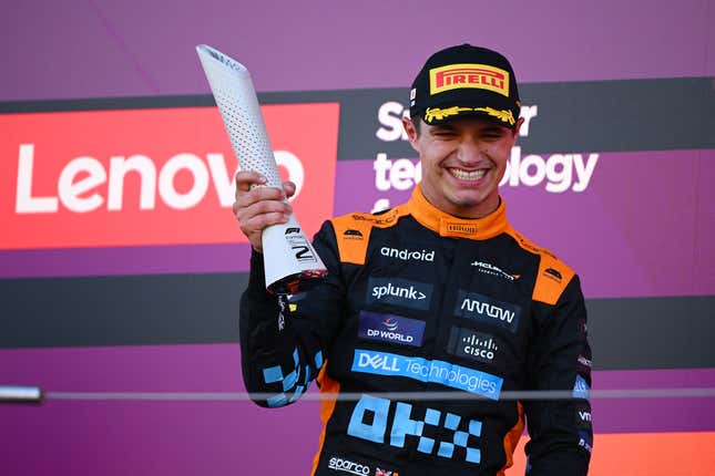 Second placed Lando Norris of Great Britain and McLaren celebrates on the podium during the F1 Grand Prix of Japan at Suzuka International Racing Course on September 24, 2023 in Suzuka, Japan.