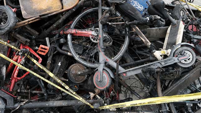 A photo of the burned remains of electric bikes and scooters. 